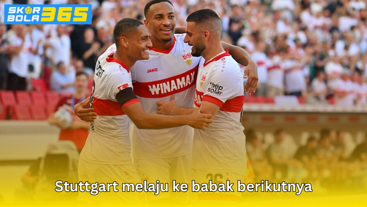 Pemain Stuttgart merayakan kemenangan yang memastikan kelolosan ke babak berikutnya kompetisi